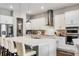 Modern kitchen with stainless steel appliances, white cabinets, and a center island with seating at 8384 Ludington Cir, Orlando, FL 32836