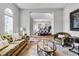 Inviting living room showcasing elegant furnishings and a view into the dining area at 8384 Ludington Cir, Orlando, FL 32836