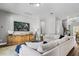Comfortable living room featuring stylish furnishings, a modern TV, and elegant decor at 8384 Ludington Cir, Orlando, FL 32836
