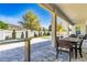 Beautiful covered patio area with outdoor dining furniture and view of the backyard pool at 8384 Ludington Cir, Orlando, FL 32836