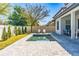 Inviting backyard pool with patio area and landscaping, perfect for outdoor relaxation and enjoyment at 8384 Ludington Cir, Orlando, FL 32836