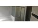 Bathroom showcasing shower with glass door and vanity at 8500 Palm Harbour Dr, Kissimmee, FL 34747