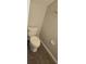 A clean bathroom featuring a standard toilet and a functional toilet paper holder, ensuring convenience at 8500 Palm Harbour Dr, Kissimmee, FL 34747