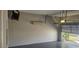Well lit garage, features a split-system air conditioner for climate control, ensuring comfort at 8500 Palm Harbour Dr, Kissimmee, FL 34747