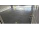 An impeccably epoxy floored garage, ensuring both aesthetic appeal and ease of maintenance at 8500 Palm Harbour Dr, Kissimmee, FL 34747
