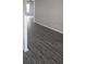 Hallway with gray walls and gray wood flooring at 8500 Palm Harbour Dr, Kissimmee, FL 34747