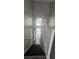 View of carpeted stairs leading from the front door to the upper levels of this beautiful home at 8500 Palm Harbour Dr, Kissimmee, FL 34747