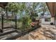 Brick patio with landscaping surrounding the backyard at 9676 Wild Oak Dr, Windermere, FL 34786