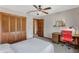 Cozy bedroom with ceiling fan, desk and wood closet at 9676 Wild Oak Dr, Windermere, FL 34786