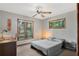 Bedroom with hardwood windows and a desk area at 9676 Wild Oak Dr, Windermere, FL 34786