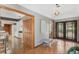 Open foyer featuring warm wood tones and views into the kitchen and front entrance at 9676 Wild Oak Dr, Windermere, FL 34786