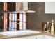 Close up of modern glass top cooktop and granite counters with plenty of meal prep space at 9676 Wild Oak Dr, Windermere, FL 34786