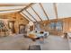 Bright living room featuring wood paneled walls and natural light at 9676 Wild Oak Dr, Windermere, FL 34786