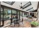Spacious sunroom with tile floor, ceiling fans, skylights and outdoor view at 9676 Wild Oak Dr, Windermere, FL 34786