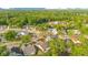 Expansive aerial shot of a residential neighborhood with tree-lined streets and single-Gathering homes at 1002 Kelsey Ave, Oviedo, FL 32765