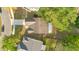 Birds-eye view of a home showcasing its roof, nearby trees, and a portion of its yard at 1002 Kelsey Ave, Oviedo, FL 32765