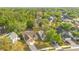 Aerial view showcasing a neighborhood with mature trees and well-maintained single-Gathering homes at 1002 Kelsey Ave, Oviedo, FL 32765