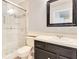 Bathroom featuring a glass enclosed shower and dark vanity at 1002 Kelsey Ave, Oviedo, FL 32765