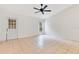 Bright bedroom with a ceiling fan, a door leading outside, and a window providing natural light at 1002 Kelsey Ave, Oviedo, FL 32765