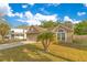 Lovely single-story house with a beautiful front yard and attached two-car garage at 1002 Kelsey Ave, Oviedo, FL 32765