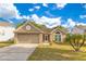 Charming single-Gathering home featuring a well-maintained lawn and a two-car garage at 1002 Kelsey Ave, Oviedo, FL 32765