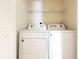 Bright laundry room featuring a Whirlpool washer and dryer at 1002 Kelsey Ave, Oviedo, FL 32765