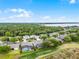Wide aerial shot of a neighborhood with golf course and waterfront view from property at 10176 Hart Branch Cir, Orlando, FL 32832