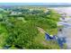 Picturesque aerial shot of a wooden walkway extending towards the waterfront gazebo at 10176 Hart Branch Cir, Orlando, FL 32832