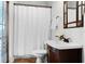Full bathroom featuring a bathtub with shower and a modern dark wood vanity at 10176 Hart Branch Cir, Orlando, FL 32832
