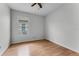 A bright bedroom offers neutral walls and floors, a ceiling fan, and natural light at 10176 Hart Branch Cir, Orlando, FL 32832