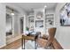 Bright home office with custom built-ins and hardwood floors providing a great workspace at 10176 Hart Branch Cir, Orlando, FL 32832