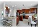 Gourmet kitchen with granite countertops, stainless steel appliances, and a center island at 10176 Hart Branch Cir, Orlando, FL 32832