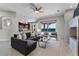 Open-concept living room featuring hardwood floors, recessed lighting, and a large sectional sofa at 10176 Hart Branch Cir, Orlando, FL 32832