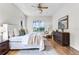 Spacious main bedroom with large window and a view of the green yard at 10176 Hart Branch Cir, Orlando, FL 32832