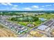 Aerial view of the community highlighting the pool, pond, and nearby new construction at 13532 Autumn Harvest Ave, Winter Garden, FL 34787