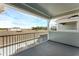 Balcony with grey floors overlooking a community with blue skies at 13532 Autumn Harvest Ave, Winter Garden, FL 34787