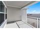 Wide balcony with white railings and views of neighboring rooftops at 13532 Autumn Harvest Ave, Winter Garden, FL 34787