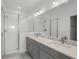 Modern bathroom with dual sinks, granite countertop, and large walk-in shower at 13532 Autumn Harvest Ave, Winter Garden, FL 34787