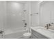 Modern bathroom with a tub and shower combination with white subway tile surround at 13532 Autumn Harvest Ave, Winter Garden, FL 34787