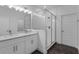 Modern bathroom with double vanity, quartz counters, and sleek glass-enclosed shower at 13532 Autumn Harvest Ave, Winter Garden, FL 34787