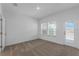 Bedroom boasts natural light, carpet, and door to a patio or balcony at 13532 Autumn Harvest Ave, Winter Garden, FL 34787