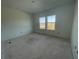 Bright bedroom with two windows providing natural light at 13532 Autumn Harvest Ave, Winter Garden, FL 34787
