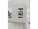 Bright bedroom features large windows overlooking the street and plush neutral carpeting at 13532 Autumn Harvest Ave, Winter Garden, FL 34787