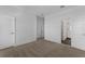Bedroom with carpet flooring adjacent to bathroom with glass enclosed shower at 13532 Autumn Harvest Ave, Winter Garden, FL 34787