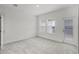 Bright bedroom with plush carpeting and sliding glass doors to balcony at 13532 Autumn Harvest Ave, Winter Garden, FL 34787