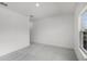 Vacant bedroom features plush carpeting and a window for natural light at 13532 Autumn Harvest Ave, Winter Garden, FL 34787