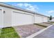Attached garages in this neighborhood with paved driveway and low-maintenance green space at 13532 Autumn Harvest Ave, Winter Garden, FL 34787