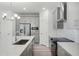 Well-equipped kitchen with stainless steel appliances, a central island, and bright, stylish lighting at 13532 Autumn Harvest Ave, Winter Garden, FL 34787