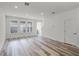 Spacious living room boasting hardwood floors, recessed lighting, and a modern, neutral color palette at 13532 Autumn Harvest Ave, Winter Garden, FL 34787