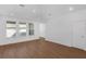 Bright, open living area featuring large windows, modern flooring, and neutral tones to create a welcoming space at 13532 Autumn Harvest Ave, Winter Garden, FL 34787